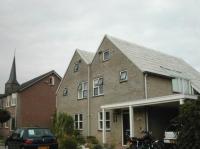 Geschakelde woningen met asymmetrische zadeldaken.